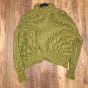 Low turtleneck green knit sweater